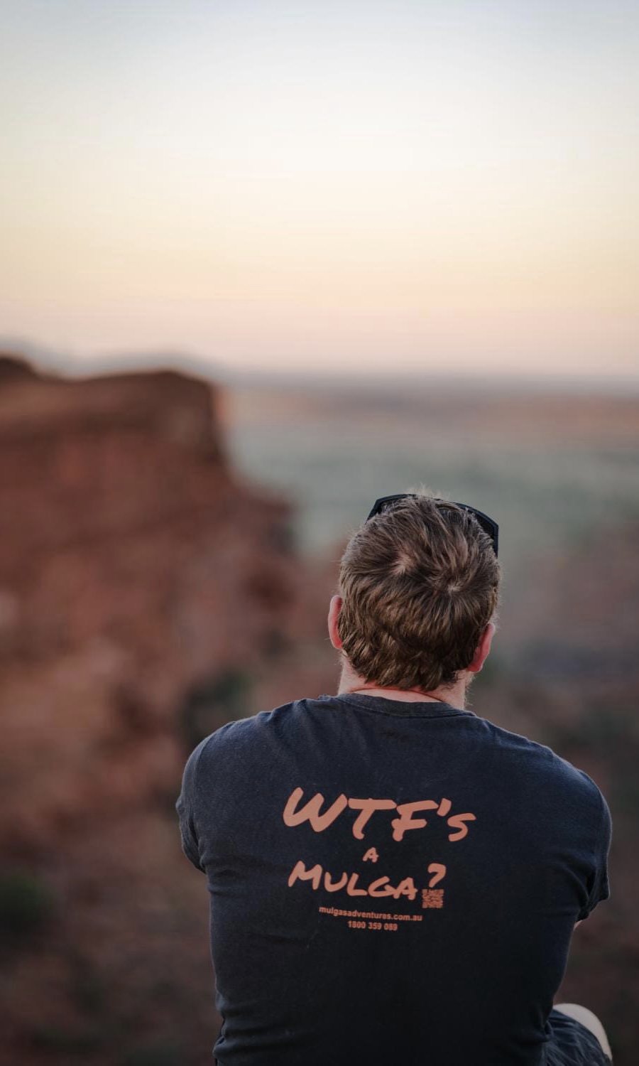 Tour guide Alex from Mulgas Adventures takes in the breathtaking views of Kings Canyon, showcasing his 